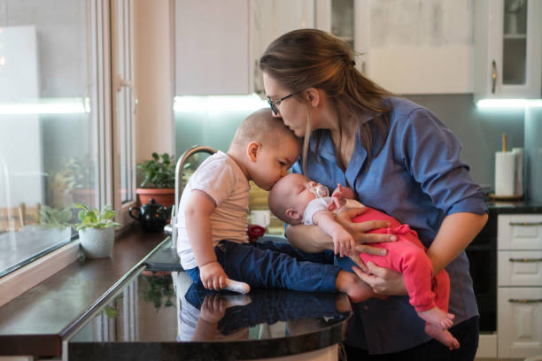 istock Mother, son and daughter in kitchen 1124300401