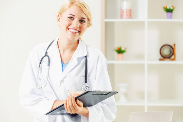 istock Young female doctor working in hospital office. 1124301931