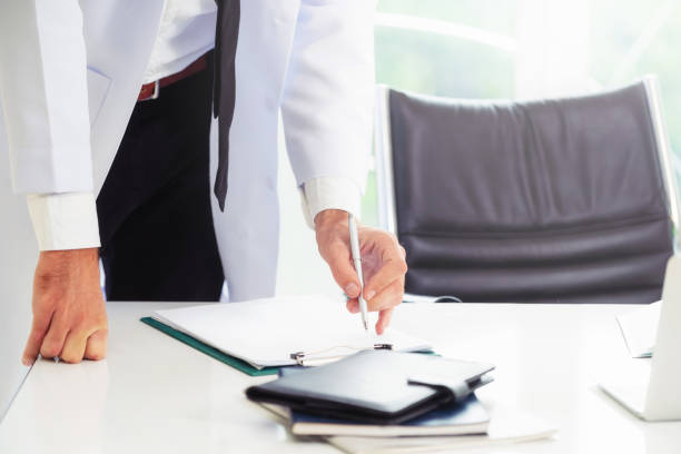 istock Young man doctor working at office in hospital. 1124302805