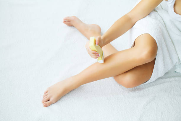 istock Depilation on the female legs with waxing 1124303892