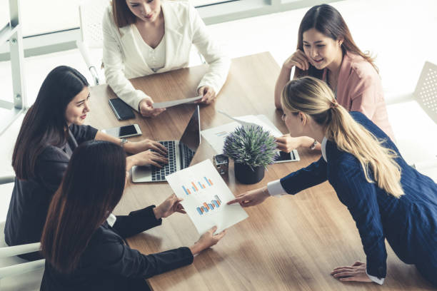 istock Businesswomen in Meeting, Laptop Computer on Table 1124304659