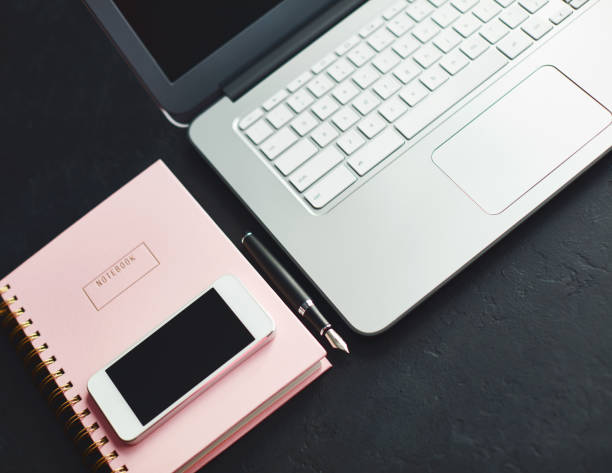 istock Writers desk with phone, keyboard and accessories 1124306517