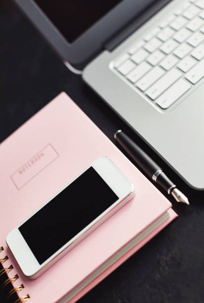 istock Writers desk with phone, keyboard and accessories 1124306577