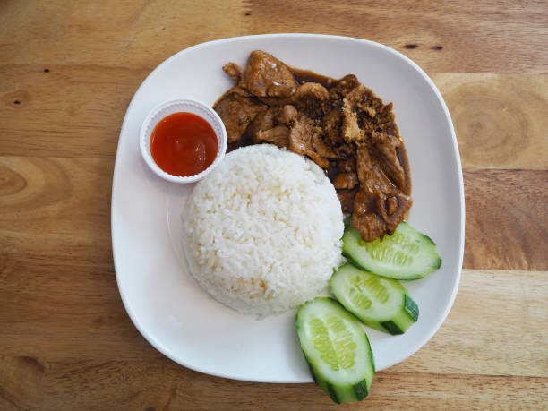 istock Rice and fried pork with cucumber 1124307093