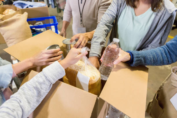 istock Group of volunteers unpack donated items 1124307261