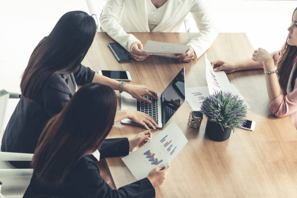 istock Businesswomen in Meeting, Laptop Computer on Table 1124307491