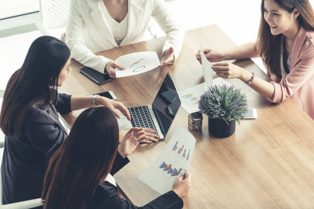 istock Businesswomen in Meeting, Laptop Computer on Table 1124307541