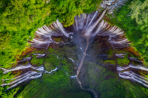 Aerial view of wonderful Tumpak Sewu waterfall in the tropical forest at Lumajang, Indonesia