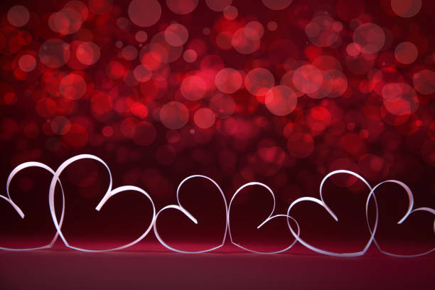 White Hearts on red background. Valentines day card. Copy space for your text. stock photo