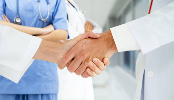 istock Doctor working in hospital with other doctors. 1124314288