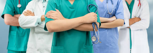 istock Doctor working in hospital with other doctors. 1124314369