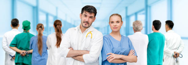 istock Doctor working in hospital with other doctors. 1124324211