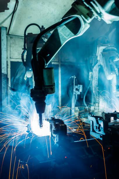 istock Robots welding in a car factory 1124327634