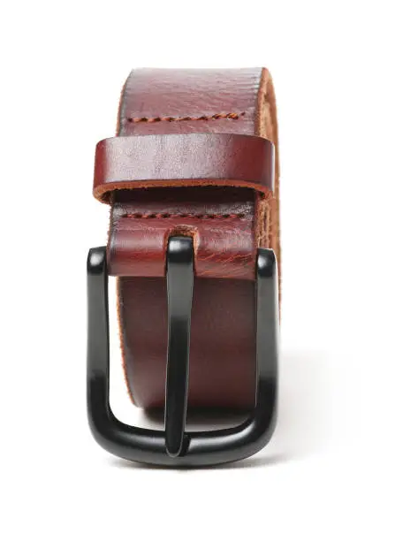 Brown leather belt with metal sliver belt-buckle on white background