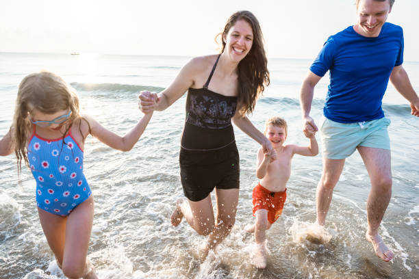 istock Family playing on the beach 1124334693