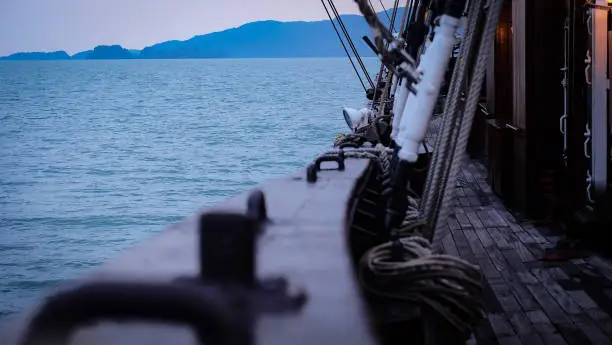 Evening view of the sea from a deck of a classic sail ship