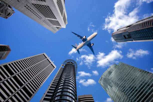 istock The plane flying on city centre. 1124339534