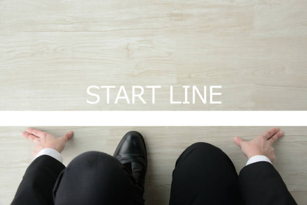 istock Business man ready for crouching start on starting line 1124346320