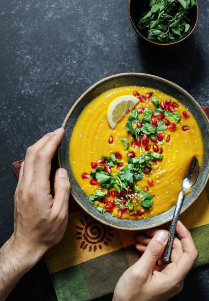 istock Fresh pumpkin soup topped with parsley and pomegranate seeds 1124347596
