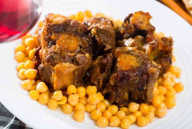 istock Braised oxtails with chickpeas on a white plate 1124351597