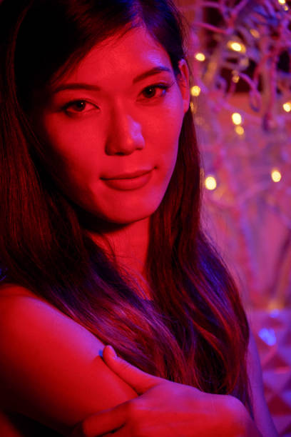 istock Pretty woman in red light 1124353531
