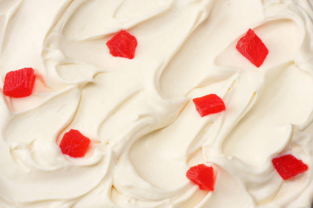 A delectable ice cream sundae topped with fruit presents a delightful sweet treat and dessert