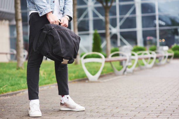 istock A young man is waiting for a passenger at the airport. 1124359242