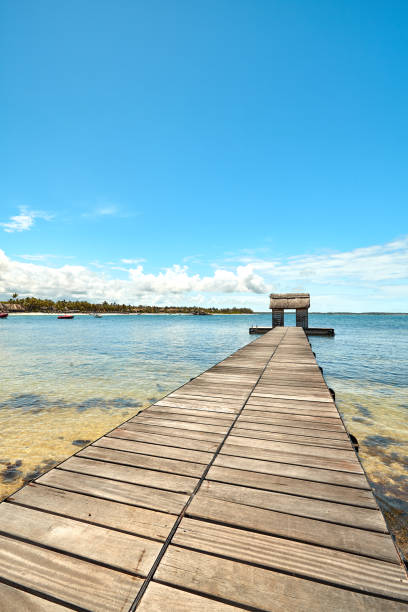istock jetty of belle mare beach, mauritius island 1124360816