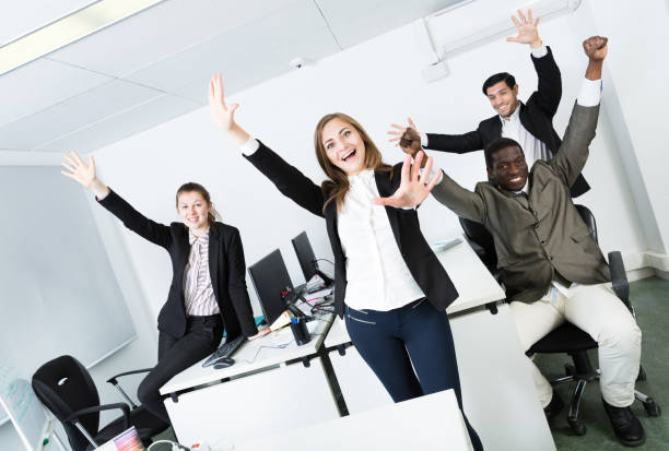 istock Group of business people celebrating victory 1124361806