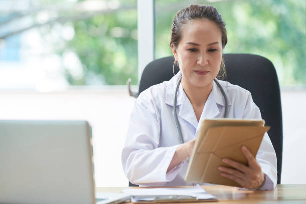 istock Female doctor with tablet 1124363167