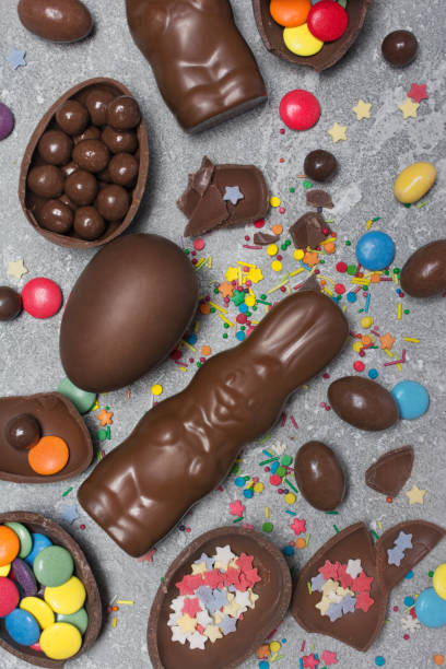 istock Top view on chocolate traditional easter eggs and bunny with bright colorful dragee 1124365282