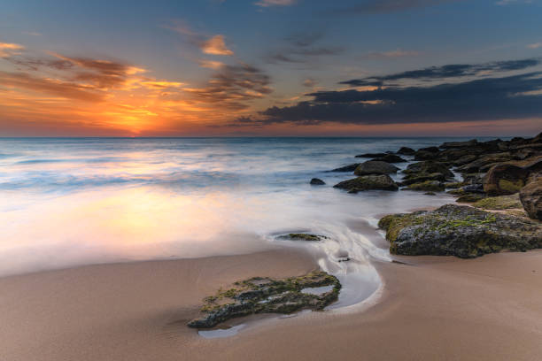 istock Sunrise Seascape and Streaky Clouds 1124365569