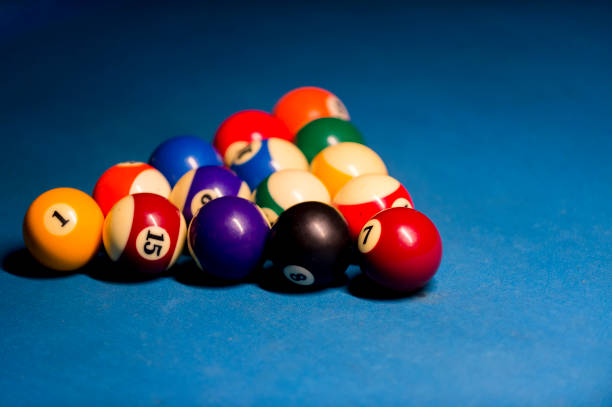 istock Billiard balls on pool blue table - sport background 1124366520