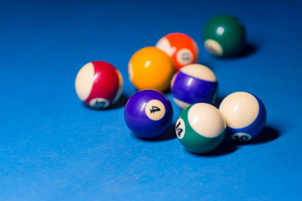 istock Billiard balls on pool blue table - sport background 1124366983