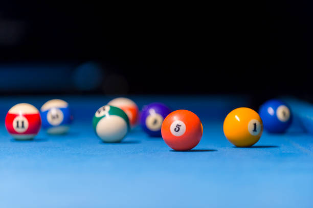 istock Billiard balls on pool blue table - sport background 1124367070