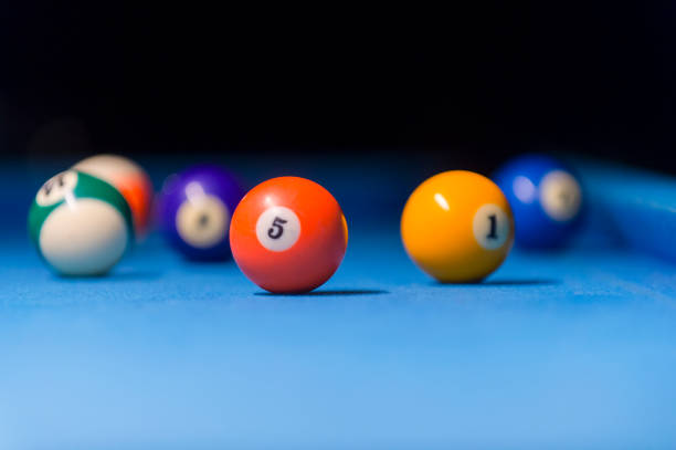 istock Billiard balls on pool blue table - sport background 1124367107