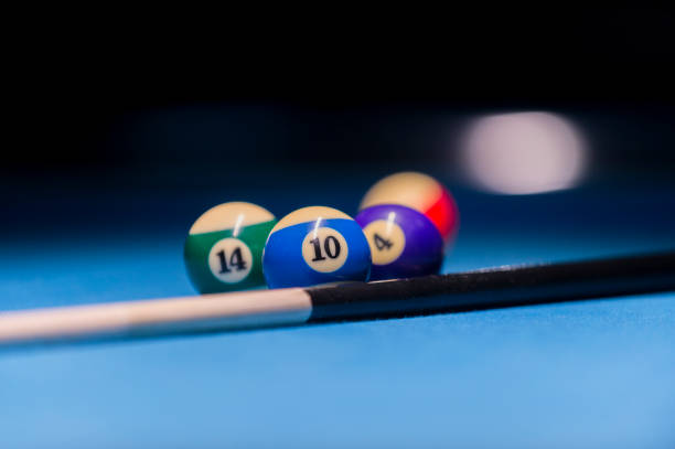 istock Billiard balls on pool blue table - sport background 1124367709