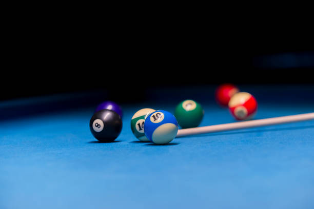 istock Billiard balls on pool blue table - sport background 1124367715