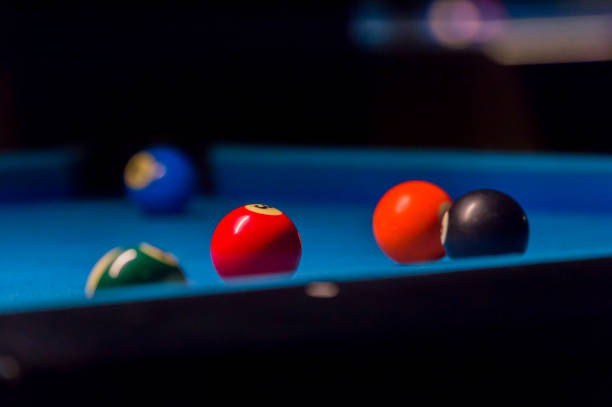 istock Billiard balls on pool blue table - sport background 1124368307
