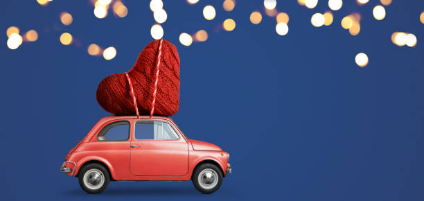 istock Toy car delivering heart 1124369238