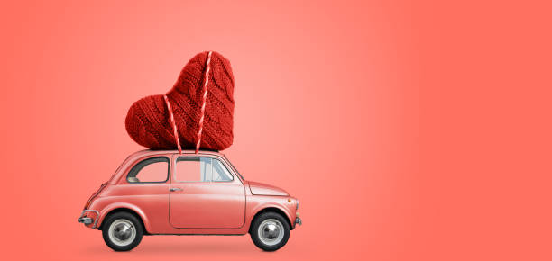 istock Toy car delivering heart 1124369240
