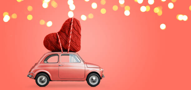 istock Toy car delivering heart 1124369241