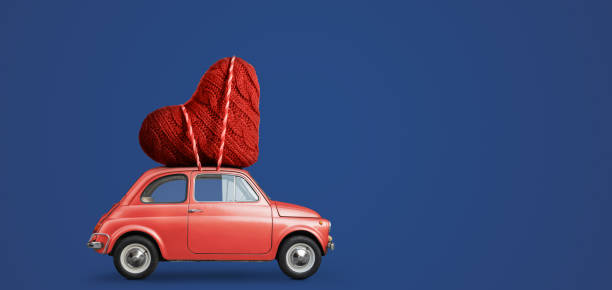 istock Toy car delivering heart 1124369242