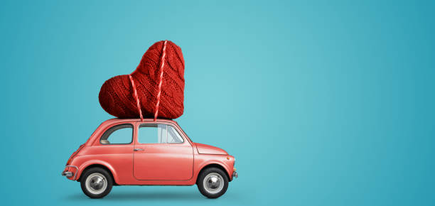 Toy car delivering heart stock photo