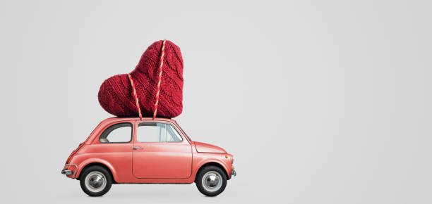 istock Toy car delivering heart 1124369246