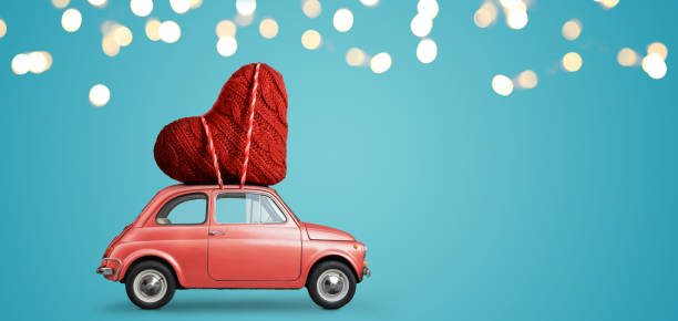 istock Toy car delivering heart 1124369247
