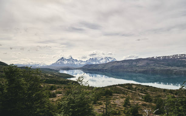istock Scenic View Of Mountains Against Cloudy Sky 1124371399
