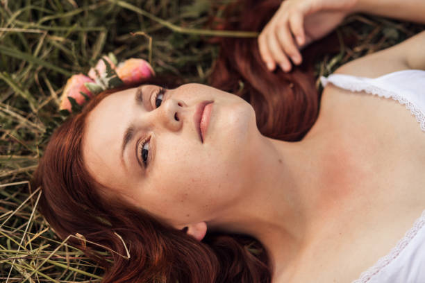 istock Beautiful young girl with a wreath on her head 1124372146