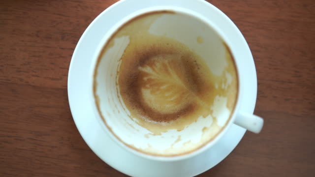 Close up latte art  of coffee after eaten on table