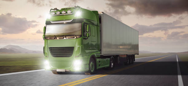 istock Truck with a trailer driving on a highway. 1124380310